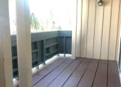 Thumbnail 29 of 31 - an empty porch with wood floors and a large window