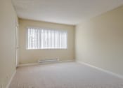 Thumbnail 16 of 33 - the spacious living room of an empty house with a window