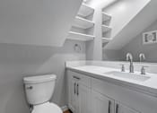 Thumbnail 48 of 53 - a bathroom with a toilet and a sink
