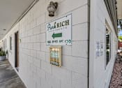 Thumbnail 43 of 44 - A sign on a building that says "Park Rich Apartments".