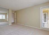 Thumbnail 9 of 33 - a spacious living room with a door to the bathroom