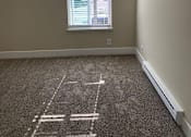 Thumbnail 4 of 43 - A room with a carpet and a window with blinds.
