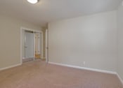 Thumbnail 34 of 37 - A room with a white door and a window.