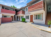 Thumbnail 15 of 25 - A modern house with a red garage door.