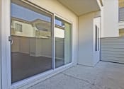Thumbnail 31 of 35 - A glass door with a handle is open.