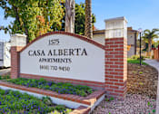 Thumbnail 37 of 67 - A sign for Casa Alberta Apartments with a phone number on it.