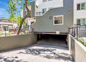 Thumbnail 27 of 41 - A modern two-story building with a garage under the letter D.