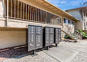 Thumbnail 26 of 51 - Three large electrical boxes are lined up on a sidewalk outside a building.
