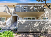 Thumbnail 41 of 51 - A modern house with a balcony and stairs leading to the second floor.