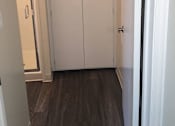 Thumbnail 19 of 31 - A white double door is closed.