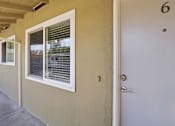 Thumbnail 15 of 17 - A white door with a number 6 above it.