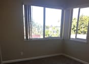 Thumbnail 19 of 26 - an empty room with a large window