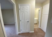 Thumbnail 27 of 51 - a room with a white door and black circles around it