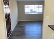 Thumbnail 12 of 43 - A room with wooden flooring and a window.