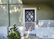 Thumbnail 15 of 50 - A white door with a diamond pattern in the middle.