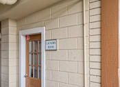 Thumbnail 8 of 14 - A white door with a sign that says Laundry Room.