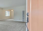 Thumbnail 8 of 29 - A room with a carpet floor and a window with blinds.