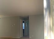 Thumbnail 28 of 37 - A room with a carpeted floor and a door.