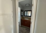 Thumbnail 45 of 51 - a bathroom with a sink and a mirror
