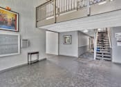 Thumbnail 2 of 41 - A room with a staircase and a no smoking sign.