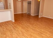 Thumbnail 25 of 25 - a living room with a wooden floor and a closet