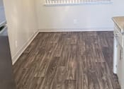 Thumbnail 25 of 37 - A room with wooden flooring and a ceiling fan.