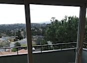 Thumbnail 16 of 22 - A view of a residential area from a balcony.