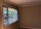 Thumbnail 24 of 62 - an empty living room with a large window