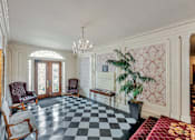 Thumbnail 25 of 42 - A room with a checkered floor and a chandelier.