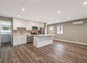 Thumbnail 43 of 62 - A spacious kitchen with a large island in the middle.