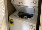 Thumbnail 18 of 22 - A white EnerGuide 180 washing machine is in a small space.
