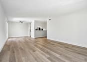 Thumbnail 83 of 92 - A room with wooden flooring and white walls.