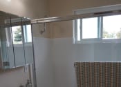 Thumbnail 8 of 22 - a small bathroom with a sink and a bath tub