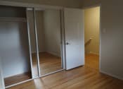Thumbnail 7 of 22 - a room with a door open to a bathroom and a closet