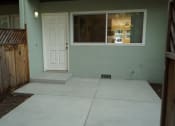 Thumbnail 9 of 22 - the front entrance of a house with a concrete walkway and a white door