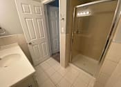 Thumbnail 37 of 41 - a bathroom with a sink and a shower
