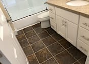 Thumbnail 23 of 62 - a bathroom with a toilet and a sink