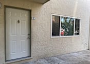 Thumbnail 11 of 22 - A white door with a number 2 on the wall above it.