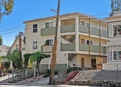 Thumbnail 4 of 36 - an apartment building with a staircase in front of it