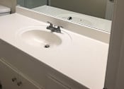 Thumbnail 26 of 26 - a bathroom with a sink and a mirror