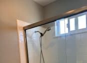 Thumbnail 47 of 51 - a bathroom with a shower and a toilet