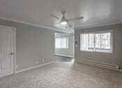 Thumbnail 37 of 60 - A room with a ceiling fan and a window with blinds.