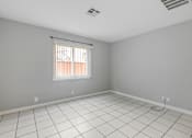 Thumbnail 38 of 38 - A room with a window and a tiled floor.