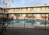 Thumbnail 47 of 62 - a swimming pool in front of a building