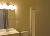 Thumbnail 26 of 31 - a bathroom with a toilet and a sink and a shower