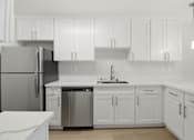 Thumbnail 46 of 92 - A modern kitchen with white cabinets and a stainless steel refrigerator.