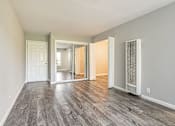 Thumbnail 35 of 42 - A room with a grey floor and white walls.