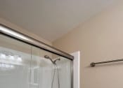 Thumbnail 29 of 36 - a bathroom with a glass shower and a toilet