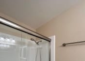 Thumbnail 30 of 36 - a bathroom with a shower and a toilet
