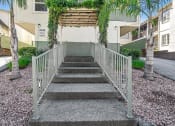 Thumbnail 8 of 36 - a metal bridge with stairs in front of an apartment building